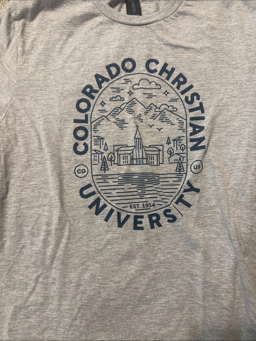 Two Colorado Christian University t-shirts